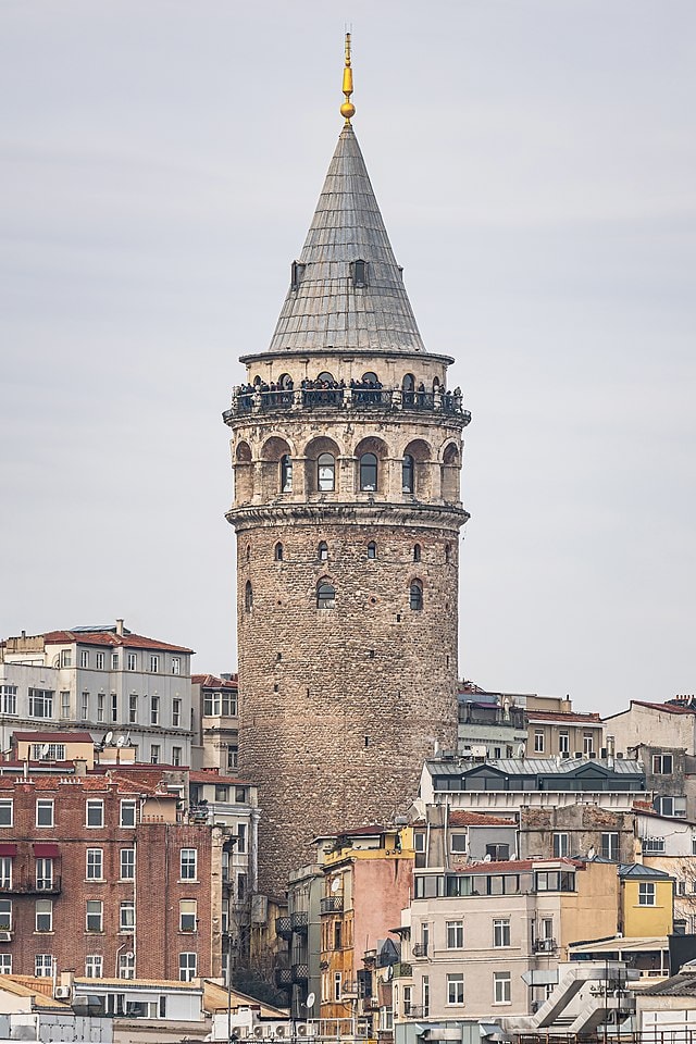 The historic Galata Tower rising above surrounding buildings in Istanbul a popular viewpoint for travelers visiting the city during a stopover.